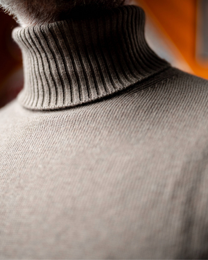 Light taupe men's cashmere sweater - back view showing turtleneck collar detail 